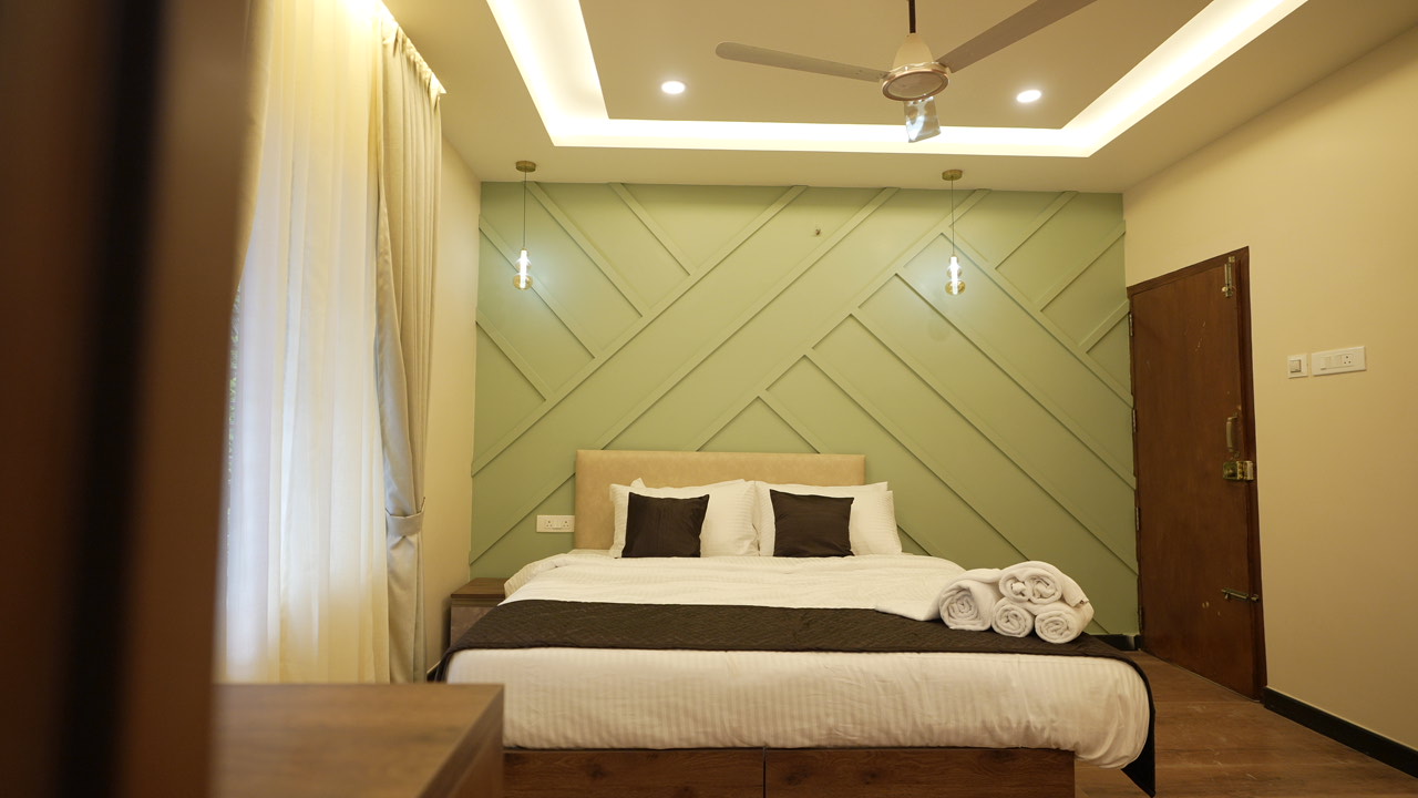 Peaceful outdoor seating and garden area at Krishna Kripa Luxury Pool Stay Varkala